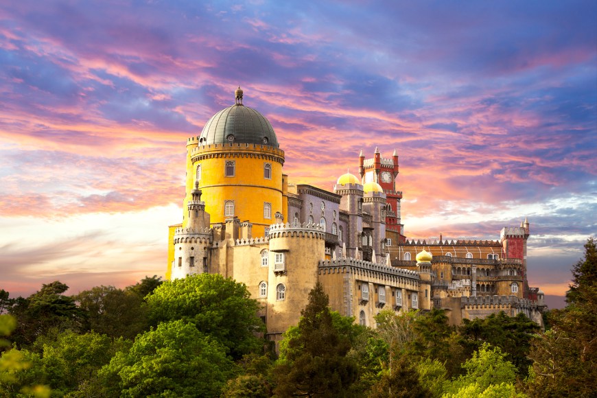 Fairy Palace against sunset sky - Panorama of Pena National Palace in Sintra, Portugal, Europe - horizontal