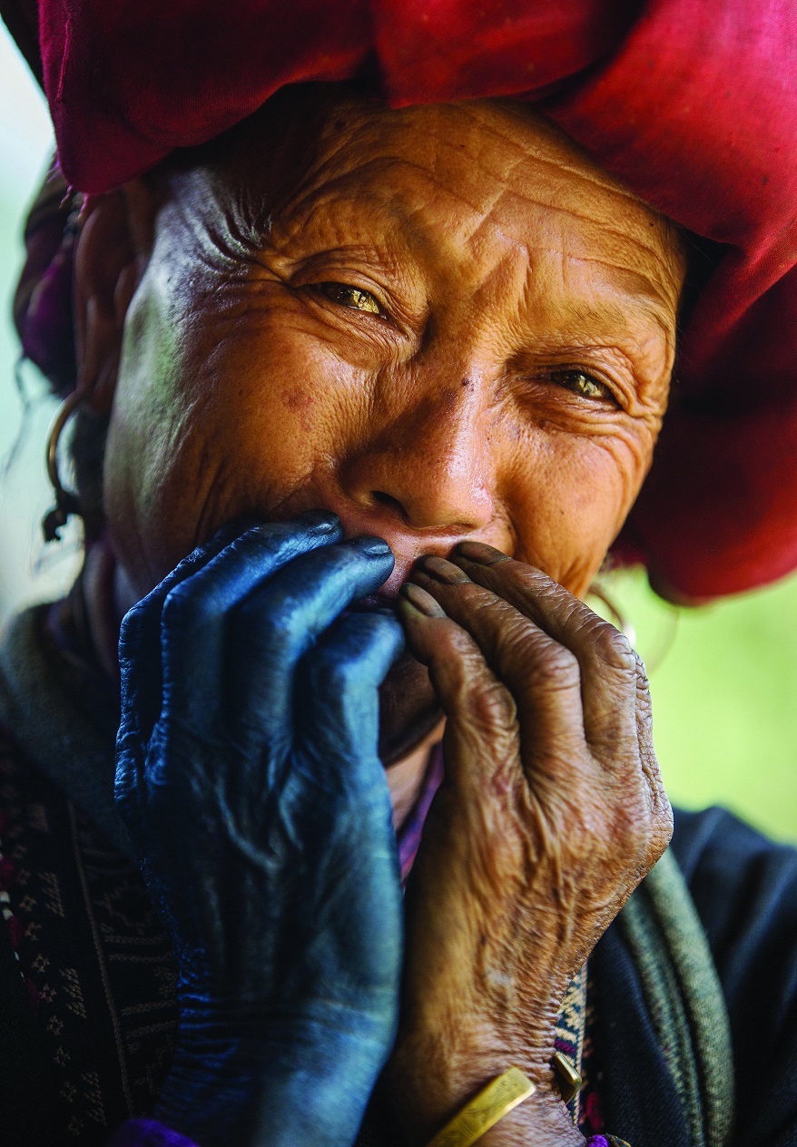 MANDATORY CREDIT: Réhahn Photography/REX Shutterstock. Only for use in this story. Editorial Use Only. No stock, books, advertising or merchandising without photographer's permission Mandatory Credit: Photo by Réhahn Photography/REX Shutterstock (5064716d) A woman of the Red Dao tribe can be seen with a red hat, and indigo-dyed blue hands, from making traditional clothing Smiling faces of North Vietnam, Vietnam - Aug 2015 FULL COPY: http://www.rexfeatures.com/nanolink/r1mu A photographer has captured a series of striking portraits of Northern Vietnam's ethnic tribes. French photographer Réhahn captured the images on a recent roadtrip through Northern Vietnam's stunning mountains. There are many different ethnic tribes in the Northern Vietnam region, each with a unique traditional clothing and a unique language. In the pictures stunning portraits can be seen of the locals, dressed in their unique colours and textile prints.