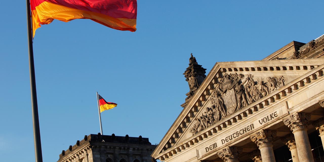 The German flag flys outside the Reichstag, the building which houses the Bundestag (the lower house of parliament), during the presidential election on June 30, 2010 in Berlin. The new German President, whose job is mostly ceremonial but who acts as a kind of national moral arbiter, is not chosen by popular vote but will be elected by a special assembly of MPs and public figures on June 30. AFP PHOTO / DAVID GANNON