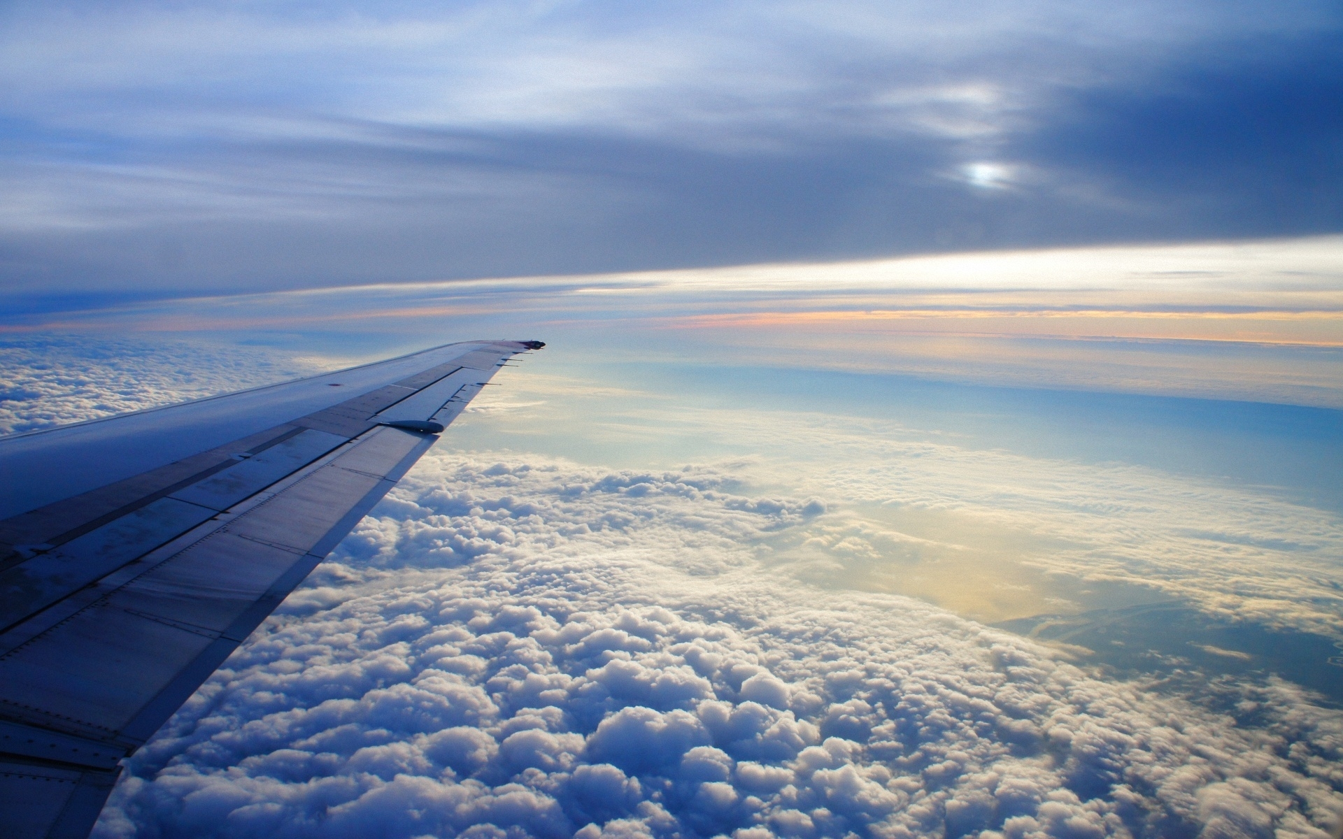 sky_altitude_clouds_airplane_wing_flying_soaring_earth_48100_1920x1200
